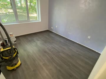 Renovated apartment room with new floor laid