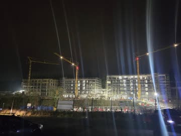 Night works - tower cranes over the site