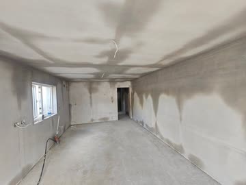 Skim coat plaster applied to walls and ceiling