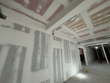 Ceiling plasterboard with beam encasement - corridor view