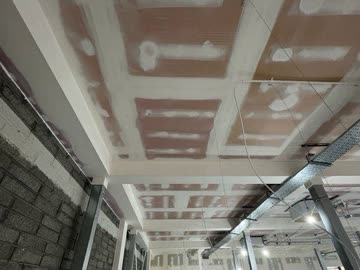 Full ceiling and beam encasement - wide span retail area