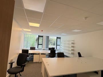 Finished offices, corridors, and meeting rooms upon project completion.