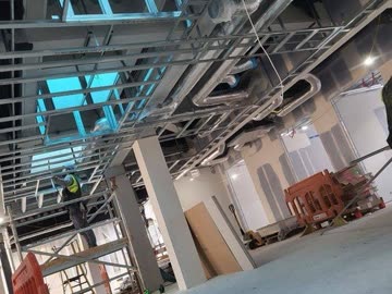 Completed corridor - painted walls and ceiling lighting