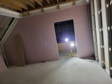 Partition boarding with Gyproc - sloped roof section