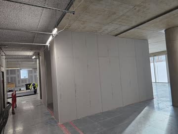 Plasterboard closed across an open commercial floor